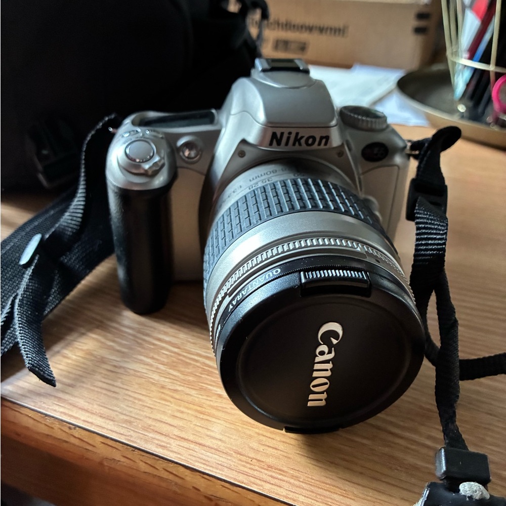 Nikon Gray Camera with Canon Lens and Lowepro Camera Case